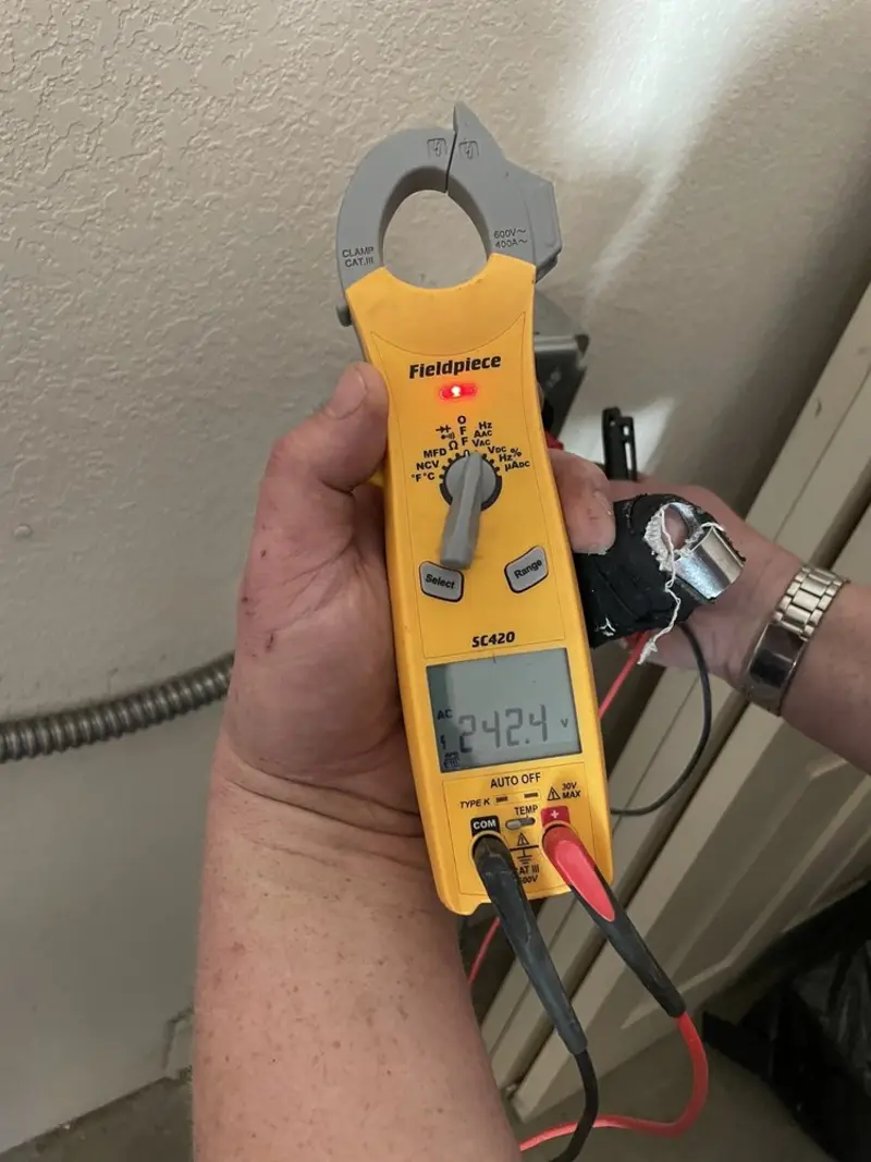 Voltage testing with clamp meter during Electrical Installation Services in Oil City